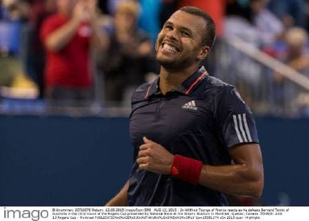 AUG 13, 2015 : Jo-Wilfried Tsonga of France reacts as he defeats Bernard Tomic of Australia in the third round of the Rogers Cup presented by National Bank at the Uniprix Stadium in Montreal, Quebec, Canada. TENNIS: AUG 13 Rogers Cup - Montreal Icon15081374 EDITORIAL USE ONLY