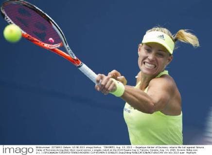 TORONTO, Aug. 13, 2015 -- Angelique Kerber of Germany returns the ball against Simona Halep of Romania during their third round women s singles match at the 2015 Rogers Cup in Toronto, Canada, Aug. 13, 2015. Simona Halep won 2-1. ) (SP)CANADA-TORONTO-TENNIS-ROGERS CUP-WOMEN S SINGLES ZouxZheng 