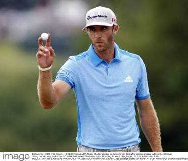 Dustin Johnson gestures to the fans after sinking a birdie putt on the 10th hole during the second round of the 97th PGA Golf Herren Championship at Whistling Straits on August 14, 2015 in Kohler, Wisconsin.  FPX20150814167 FRANKxPOLICH