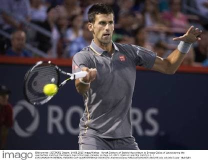 Novak Djokovic of Serbia hits a return to Ernests Gulbis of Latvia during the quarterfinal match at the Rogers Cup in Montreal, Canada, on Aug. 14, 2015. Djokovic won the match 2-1. ) (SP)CANADA-MONTREAL-ROGERS-CUP-QUARTERFINALS-DJOKOVIC AndrewxSoong 