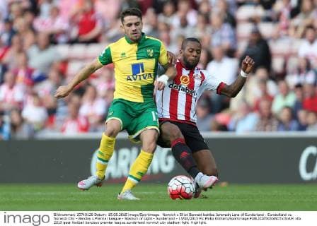 Norwich s Elliot Bennett battles Jeremain Lens of Sunderland - Sunderland vs. Norwich City - Barclay s Premier League - Stadium of Light - Sunderland - 15 08 2015 Pic Philip Oldham Sportimage EDITORIAL USE ONLY. No use with unauthorised audio, video, data, fixture lists, club league logos or live services. Online in-match use limited to 120 images, no video emulation. No use in betting, games or single club league player publications.