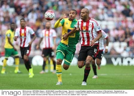 Norwich s Lewis Grabban battles Younes Kaboul of Sunderland - Sunderland vs. Norwich City - Barclay s Premier League - Stadium of Light - Sunderland - 15 08 2015 Pic Philip Oldham Sportimage EDITORIAL USE ONLY. No use with unauthorised audio, video, data, fixture lists, club league logos or live services. Online in-match use limited to 120 images, no video emulation. No use in betting, games or single club league player publications.