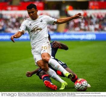 15.08.2015. Swansea, Wales. Barclays Premier League. Swansea versus Newcastle. Swansea City s Jefferson Montero gets tackled by Newcastle United s Chancel Mbemba. xPaulxJenkinsx  ActionPlus11649777