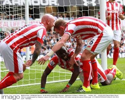 Tottenham Hotspur v Stoke City . . London, UK . . 15.08.2015 Mame Biram Diouf (SC) is congratulated by Stephen Ireland (SC) and Glenn Whelan (SC) after scoring the second Stoke goal. 2-2 
