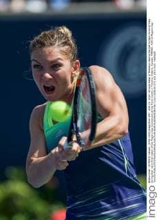 AUG 15, 2015: Simona Halep of Romania returns the ball to Sara Errani of Italy during their semi-final match of the Rogers Cup tournament at the Aviva Centre in Toronto, Ontario, Canada. TENNIS: AUG 15 Rogers Cup - Toronto Icon15081501371 EDITORIAL USE ONLY