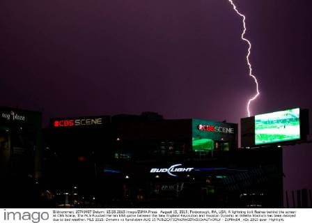 August 15, 2015; Foxborough, MA, USA; A lightning bolt flashes behind the screen at CBS Scene. The MLS Fussball Herren USA game between the New England Revolution and Houston Dynamo at Gillette Stadium has been delayed due to bad weather. MLS 2015: Dynamo vs Revolution AUG 15 - ZUMAc04_
