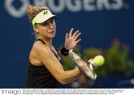 AUG 15, 2015: Belinda Bencic of Switzerland returns the ball to Serena Williams of the United States during their semi-final match of the Rogers Cup tournament at the Aviva Centre in Toronto, Ontario, Canada. TENNIS: AUG 15 Rogers Cup - Toronto Icon15081505762 EDITORIAL USE ONLY