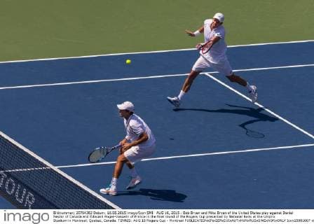 AUG 16, 2015 : Bob Bryan and Mike Bryan of the United States play against Daniel Nestor of Canada and Edouard Roger-Vasselin of France in the final round of the Rogers Cup presented by National Bank at the Uniprix Stadium in Montreal, Quebec, Canada. TENNIS: AUG 16 Rogers Cup - Montreal Icon15081607 EDITORIAL USE ONLY