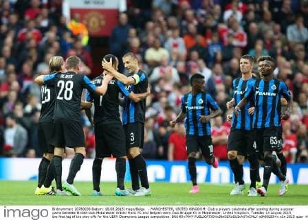 - MANCHESTER, UNITED KINGDOM: Club s players celebrate after scoring during a soccer game between British club Manchester United ManU FC and Belgian team Club Brugge KV in Manchester, United Kingdom, Tuesday 18 August 2015, the first leg of the play-offs for the UEFA Champions League competition. BRUNOxFAHY  x04682694x