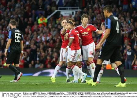 - MANCHESTER, UNITED KINGDOM: Manchester s Memphis Depay (C) celebrates with teammates after scoring during a soccer game between British club Manchester United ManU FC and Belgian team Club Brugge KV in Manchester, United Kingdom, Tuesday 18 August 2015, the first leg of the play-offs for the UEFA Champions League competition. BRUNOxFAHY  x04682695x