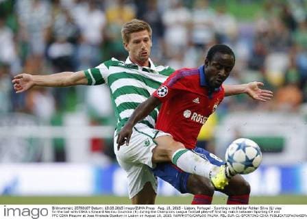 Aug. 18, 2015 - Lisbon, Portugal - Sporting s midfielder Adrien Silva (L) vies for the ball with CSKA s forward Seydou Doumbia (R) during the Champions League football play-off first leg match between Sporting CP and PFC CSKA Moscow at Jose Alvalade Stadium in Lisbon on August 18, 2015. NURPHOTO CARLOS PALMA. FBL-EUR-C1-SPORTING-CSKA  - ZUMAn230