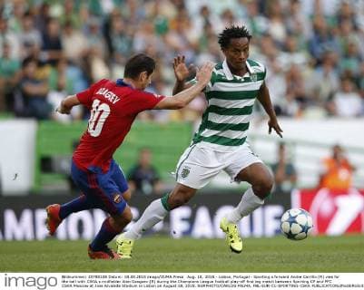 Aug. 18, 2015 - Lisbon, Portugal - Sporting s forward Andre Carrillo (R) vies for the ball with CSKA s midfielder Alan Dzagoev (R) during the Champions League football play-off first leg match between Sporting CP and PFC CSKA Moscow at Jose Alvalade Stadium in Lisbon on August 18, 2015. NURPHOTO CARLOS PALMA. FBL-EUR-C1-SPORTING-CSKA  - ZUMAn230
