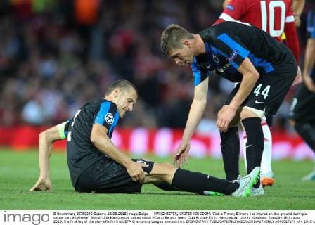 - MANCHESTER, UNITED KINGDOM: Club s Timmy Simons lies injured on the ground during a soccer game between British club Manchester United ManU FC and Belgian team Club Brugge KV in Manchester, United Kingdom, Tuesday 18 August 2015, the first leg of the play-offs for the UEFA Champions League competition. BRUNOxFAHY  x04682717x