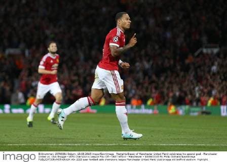 Memphis Depay of Manchester United ManU celebrates his second goal - Manchester United vs. Club Brugge - UEFA Champion s League Play Off - Old Trafford - Manchester - 18 08 2015 Pic Philip Oldham SportImage EDITORIAL USE ONLY. No use with unauthorised audio, video, data, fixture lists, club league logos or live services. Online in-match use limited to 120 images, no video emulation. No use in betting, games or single club league player publications.