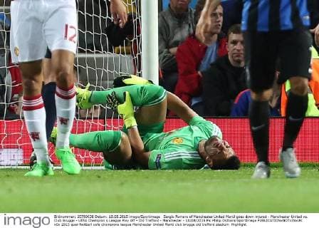 Sergio Romero of Manchester United ManU goes down injured - Manchester United vs. Club Brugge - UEFA Champion s League Play Off - Old Trafford - Manchester - 18 08 2015 Pic Philip Oldham SportImage EDITORIAL USE ONLY. No use with unauthorised audio, video, data, fixture lists, club league logos or live services. Online in-match use limited to 120 images, no video emulation. No use in betting, games or single club league player publications.