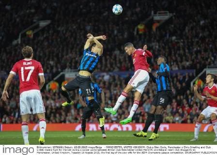 - MANCHESTER, UNITED KINGDOM: Club s Dion Cools, Manchester s Chris Smalling and Club s Obbi Oulare fight for the ball during a soccer game between British club Manchester United ManU FC and Belgian team Club Brugge KV in Manchester, United Kingdom, Tuesday 18 August 2015, the first leg of the play-offs for the UEFA Champions League competition. BRUNOxFAHY  x04682753x