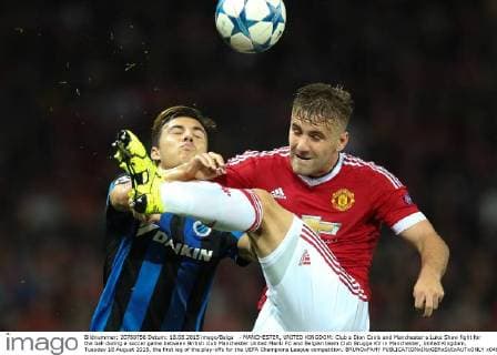 - MANCHESTER, UNITED KINGDOM: Club s Dion Cools and Manchester s Luke Shaw fight for the ball during a soccer game between British club Manchester United ManU FC and Belgian team Club Brugge KV in Manchester, United Kingdom, Tuesday 18 August 2015, the first leg of the play-offs for the UEFA Champions League competition. BRUNOxFAHY  x04682758x