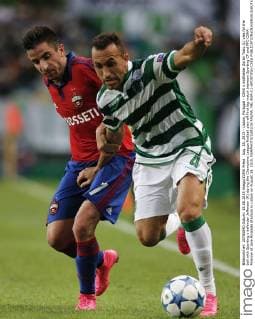 Aug. 18, 2015 - Lisbon, Portugal - CSKA s midfielder Zoran Tosic (L) vies for the ball with Sporting s defender Jefferson (R) during the Champions League football play-off first leg match between Sporting CP and PFC CSKA Moscow at Jose Alvalade Stadium in Lisbon on August 18, 2015. NURPHOTO CARLOS PALMA. FBL-EUR-C1-SPORTING-CSKA  - ZUMAn230