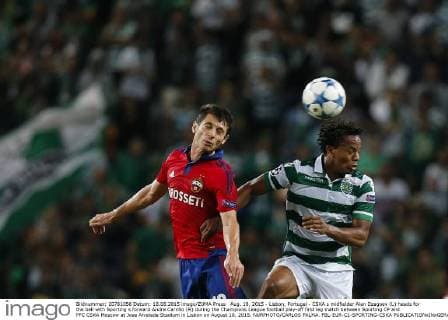Aug. 18, 2015 - Lisbon, Portugal - CSKA s midfielder Alan Dzagoev (L) heads for the ball with Sporting s forward Andre Carrillo (R) during the Champions League football play-off first leg match between Sporting CP and PFC CSKA Moscow at Jose Alvalade Stadium in Lisbon on August 18, 2015. NURPHOTO CARLOS PALMA. FBL-EUR-C1-SPORTING-CSKA  - ZUMAn230