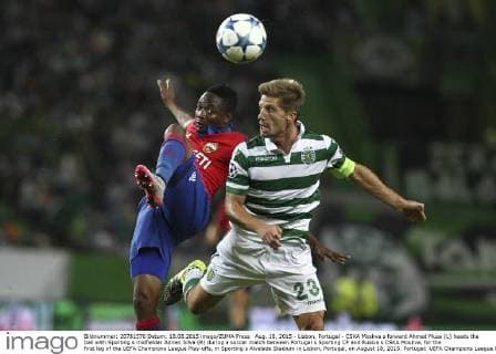 Aug. 18, 2015 - Lisbon, Portugal - CSKA Moskva s forward Ahmed Musa (L) heads the ball with Sporting s midfielder Adrien Silva (R) during a soccer match between Portugal s Sporting CP and Russia s CSKA Moskva, for the first leg of the UEFA Champions League Play-offs, in Sporting s Alvalade Stadium in Lisbon, Portugal, on August 18, 2015. Portugal: UEFA Champions League Playoff Sporting Vs CSKA Moskva - ZUMAn272