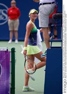 Aug. 19, 2015 - Mason, Ohio, USA - Kristina Mladenovic (FRA) goes to the bench to get attention from a trainer after falling in Wednesday s round of the Western and Southern Open at at the Lindner Family Tennis Center , Mason, Oh. Tennis 2015 - Western & Southern Open - ZUMAs304