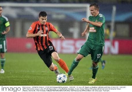 SOCCER - CL play off, Rapid vs Shakhtar VIENNA,AUSTRIA,19.AUG.15 - SOCCER - UEFA Champions League, play off, SK Rapid Wien vs FC Shakhtar Donetsk. Image shows Maksym Malyshev (Shakhtar) and Christopher Dibon (Rapid). Keywords: Wien Energie. GEPAxpictures xPhilippxBrem