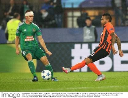 SOCCER - CL play off, Rapid vs Shakhtar VIENNA,AUSTRIA,19.AUG.15 - SOCCER - UEFA Champions League, play off, SK Rapid Wien vs FC Shakhtar Donetsk. Image shows Srdjan Grahovac (Rapid) and Alex Teixeira (Donetsk). Keywords: Wien Energie. GEPAxpictures xChristianxOrt