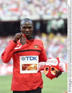 (150822) --BEIJING, Aug 22, 2015 -- Bronze medallist Munyo Solomon Mutai of Uganda poses for photo during the awarding ceremony for the men s marathon at the 15th IAAF World Athletics Championships 2015 in Beijing, capital of China, on Aug. 22, 2015. ) (SP)CHINA-BEIJING-IAAF WORLD CHAMPIONSHIPS-MEN S MARATHON (CN) YuexYuewei 
