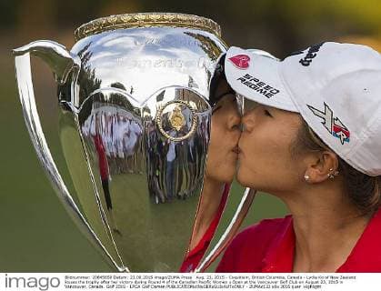 Aug. 23, 2015 - Coquitlam, British Columbia, Canada - Lydia Ko of New Zealand kisses the trophy after her victory during Round 4 of the Canadian Pacific Women s Open at the Vancouver Golf Club on August 23, 2015 in Vancouver, Canada. Golf 2015 - LPGA Golf Damen - ZUMAc132