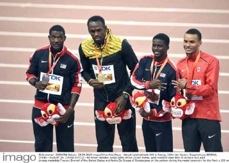 Aktuell Leichtathletik WM in Peking, 100m der Herren, Siegerehrung BEIJING, CHINA - AUGUST 24: (CHINA OUT) (L - R) Silver medalist Justin Gatlin of the United States, gold medalist Usain Bolt of Jamaica and joint bronze medalists Trayvon Bromell of the United States and Andre De Grasse of Canada pose on the podium during the medal ceremony for the Men s 100 metres final during day three of the 15th IAAF World Athletics Championships Beijing 2015 at Beijing National Stadium on August 24, 2015 in Beijing, China.  CFP471846161 