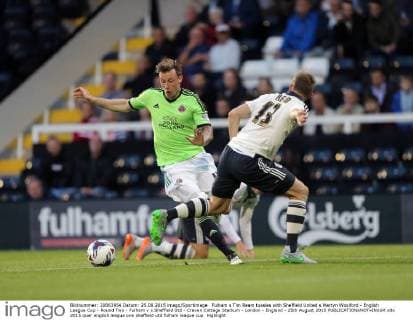 Fulham s Tim Ream tussles with Sheffield United s Martyn Woolford - English League Cup - Round Two - Fulham v s Sheffield Utd - Craven Cottage Stadium - London - England - 25th August 2015 EDITORIAL USE ONLY. No use with unauthorised audio, video, data, fixture lists, club league logos or live services. Online in-match use limited to 120 images, no video emulation. No use in betting, games or single club league player publications.