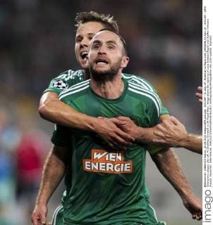 SOCCER - CL play off, Shakhtar vs Rapid LVIV,UKRAINE,25.AUG.15 - SOCCER - UEFA Champions League, play off, FC Shakhtar Donetsk vs SK Rapid Wien. Image shows the rejoicing of Louis Schaub (Rapid) and Steffen Hofmann (Rapid). Keywords: Wien Energie. GEPAxpictures xPhilippxBrem