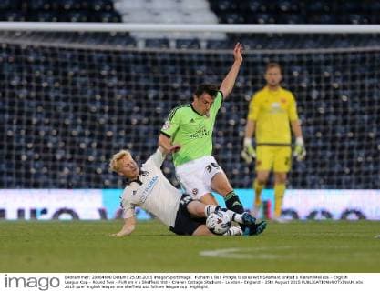 Fulham s Ben Pringle tussles with Sheffield United s Kieran Wallace - English League Cup - Round Two - Fulham v s Sheffield Utd - Craven Cottage Stadium - London - England - 25th August 2015 EDITORIAL USE ONLY. No use with unauthorised audio, video, data, fixture lists, club league logos or live services. Online in-match use limited to 120 images, no video emulation. No use in betting, games or single club league player publications.