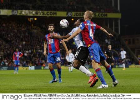 25.08.2015. London, England. Capital One Cup 2nd Round. Crystal Palace versus Shrewsbury. Shrewsbury Town s Jean-Louis Akpa Akpro shields the ball from Crystal Palace& x2019;s Brede Hangeland xCraigxMercerx  ActionPlus11653617