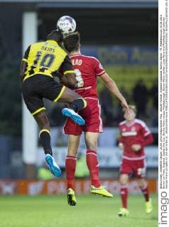 Aktuell FuÃŸball, England Ligapokal, Burton Albion - FC Middlesbrough 25.08.2015. Burton-on-Trent, England. Capital One Cup. Burton Albion versus Middlesbrough. Burton Albion striker Lucas Akins and Middlesbrough defender George Friend compete for the ball in the air. xRolandxHarrisonx  ActionPlus11653630