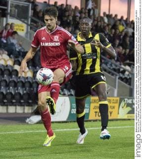 Aktuell FuÃŸball, England Ligapokal, Burton Albion - FC Middlesbrough 25.08.2015. Burton-on-Trent, England. Capital One Cup. Burton Albion versus Middlesbrough. Middlesbrough defender George Friend defends the ball against Burton Albion striker Lucas Akins. xRolandxHarrisonx  ActionPlus11653634