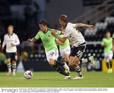 Fulham s Dan Burn tussles with Sheffield United s Marc McNulty - English League Cup - Round Two - Fulham v s Sheffield Utd - Craven Cottage Stadium - London - England - 25th August 2015 EDITORIAL USE ONLY. No use with unauthorised audio, video, data, fixture lists, club league logos or live services. Online in-match use limited to 120 images, no video emulation. No use in betting, games or single club league player publications.