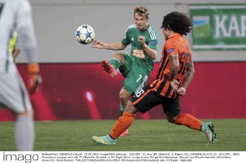 SOCCER - CL play off, Shakhtar vs Rapid LVIV,UKRAINE,25.AUG.15 - SOCCER - UEFA Champions League, play off, FC Shakhtar Donetsk vs SK Rapid Wien. Image shows Philipp Schobesberger (Rapid) and Marcio Azevedo (Shakhtar). Keywords: Wien Energie. GEPAxpictures xPhilippxBrem