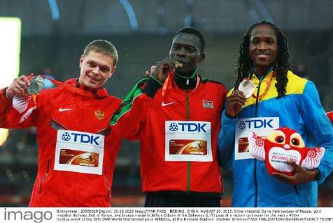 BEIJING, CHINA. AUGUST 26, 2015. Silver medalist Denis Kudryavtsev of Russia, gold medalist Nicholas Bett of Kenya, and bronze medalist Jeffery Gibson of the Bahamas (L-R) pose at a victory ceremony for the men s 400m hurdles event at the 15th IAAF World Championships in Athletics, at the National Stadium. Vladimir Smirnov TASS  TS00B702