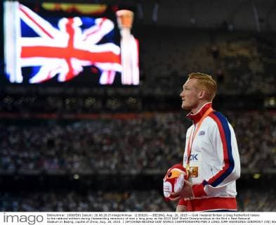 (150826) -- BEIJING, Aug. 26, 2015 -- Gold medalist Britain s Greg Rutherford listens to the national anthem during theawarding ceremony of men s long jump at the 2015 IAAF World Championships at the Bird s Nest National Stadium in Beijing, capital of China, Aug. 26, 2015. ) (SP)CHINA-BEIJING-IAAF WORLD CHAMPIONSHIPS-MEN S LONG JUMP AWARDING CEREMONY (CN) WangxHaofei 