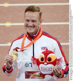 BEIJING, CHINA. AUGUST 26, 2015. Gold medalist Greg Rutherford of Great Britain poses at a victory ceremony for the men s long jump event at the 15th IAAF World Championships in Athletics, at the National Stadium. Valery Sharifulin TASS  TS00B7C6