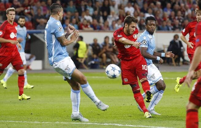 Hakan Calhanoglu (Bayer 04 Leverkusen) (R) kicks during the Championsleague Qualification between Bayer 04 Leverkusen and Lazio Rom, Bayarena in Leverkusen on August 26., 2015. Bayer 04 Leverkusen vs. Lazi Rom in der Qualifikation der Champions League der Saison 2015 2016 am 26. August 2015.