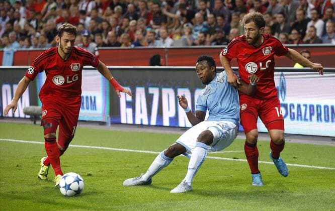 Stefan Vrij (Lazio Rom) (M) against Hakan Calhanoglu (Bayer 04 Leverkusen) (L) and Admir Mehmedi (Bayer 04 Leverkusen) during the Championsleague Qualification between Bayer 04 Leverkusen and Lazio Rom, Bayarena in Leverkusen on August 26., 2015. Bayer 04 Leverkusen vs. Lazi Rom in der Qualifikation der Champions League der Saison 2015 2016 am 26. August 2015.