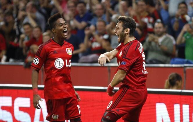 Hakan Calhanoglu (Bayer 04 Leverkusen) (R) celebrates scoring the 1:0 goal with Wendell (Bayer 04 Leverkusen) during the Championsleague Qualification between Bayer 04 Leverkusen and Lazio Rom, Bayarena in Leverkusen on August 26., 2015. Bayer 04 Leverkusen vs. Lazi Rom in der Qualifikation der Champions League der Saison 2015 2016 am 26. August 2015.