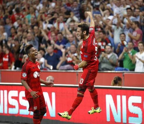 Hakan Calhanoglu (Bayer 04 Leverkusen) (R) celebrates scoring the 1:0 goal with Wendell (Bayer 04 Leverkusen) during the Championsleague Qualification between Bayer 04 Leverkusen and Lazio Rom, Bayarena in Leverkusen on August 26., 2015. Bayer 04 Leverkusen vs. Lazi Rom in der Qualifikation der Champions League der Saison 2015 2016 am 26. August 2015.
