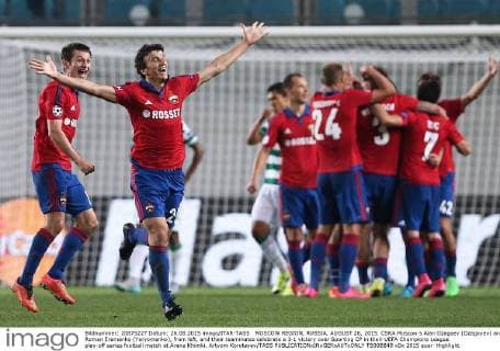 MOSCOW REGION, RUSSIA. AUGUST 26, 2015. CSKA Moscow s Alan Dzagoev (Dzagoyev) and Roman Eremenko (Yeryomenko), from left, and their teammates celebrate a 3-1 victory over Sporting CP in their UEFA Champions League play-off series football match at Arena Khimki. Artyom Korotayev TASS  TS00B849