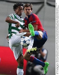 MOSCOW REGION, RUSSIA. AUGUST 26, 2015. Sporting s Andre Carrillo (L) and CSKA Moscow s Georgi Schennikov (Georgy Shchennikov) jump to kick the ball in their UEFA Champions League play-off series football match at Arena Khimki. CSKA Moscow won the game 3-1. Artyom Korotayev TASS  TS00B83E