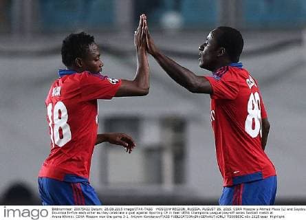 MOSCOW REGION, RUSSIA. AUGUST 26, 2015. CSKA Moscow s Ahmed Musa (L) and Seydou Doumbia hi-five each other as they celebrate a goal against Sporting CP in their UEFA Champions League play-off series football match at Arena Khimki. CSKA Moscow won the game 3-1. Artyom Korotayev TASS  TS00B83C