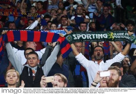 MOSCOW REGION, RUSSIA. AUGUST 26, 2015. CSKA Moscow fans and Sporting CP fans hold up scarves as they watch a UEFA Champions League play-off series football match between CSKA Moscow and Sporting CP at Arena Khimki. CSKA Moscow won 3-1. Artyom Korotayev TASS  TS00B83B