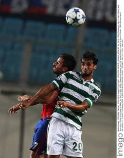 MOSCOW REGION, RUSSIA. AUGUST 26, 2015. CSKA Moscow s Zoran Tosic (front) and Sporting s Bryan Ruiz jump to head the ball in their UEFA Champions League play-off series football match at Arena Khimki. CSKA Moscow won the game 3-1. Artyom Korotayev TASS  TS00B832